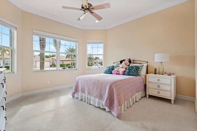 carpeted bedroom featuring ceiling fan and ornamental molding