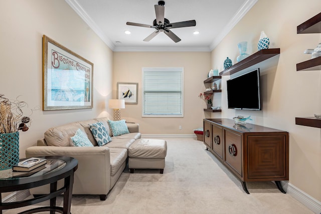 carpeted living room featuring ceiling fan and ornamental molding