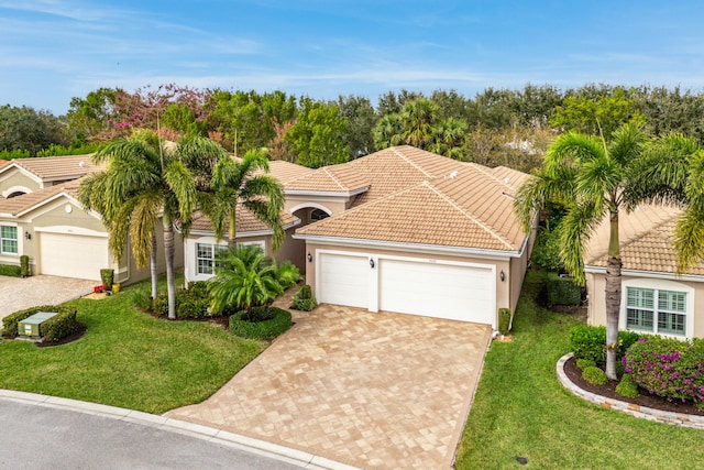 view of front of home featuring a front yard and a garage