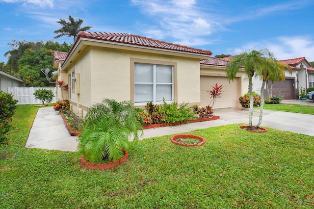 view of front of house with a front yard and a garage