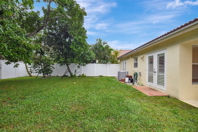 view of yard featuring french doors