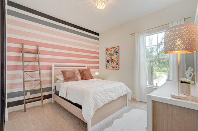 bedroom featuring light colored carpet