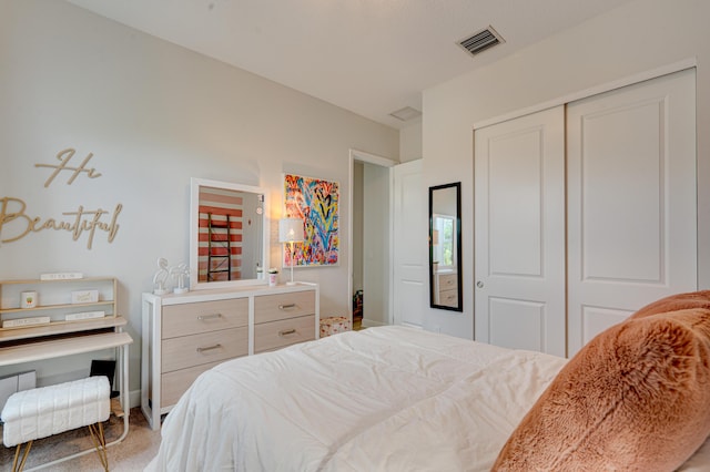 carpeted bedroom with a closet