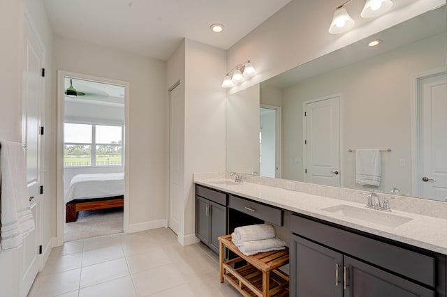 bathroom featuring tile patterned flooring and vanity