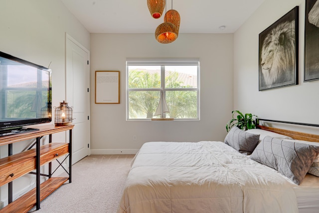 bedroom featuring light colored carpet