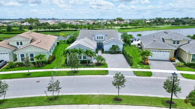 birds eye view of property with a water view