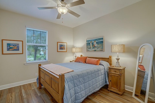 bedroom featuring ceiling fan and light hardwood / wood-style flooring