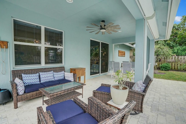 view of patio with ceiling fan and an outdoor living space