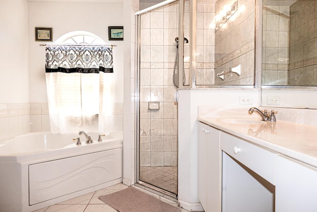 bathroom featuring tile patterned floors, vanity, and separate shower and tub