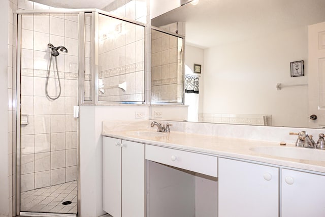 bathroom with vanity and an enclosed shower