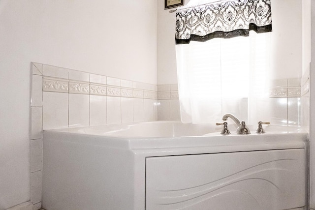 bathroom featuring a tub to relax in