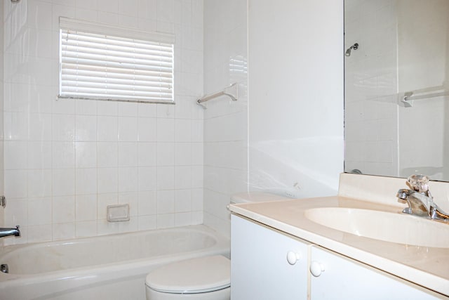 full bathroom with vanity, toilet, and tiled shower / bath