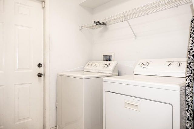 washroom featuring separate washer and dryer