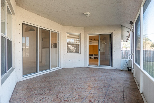 unfurnished sunroom with plenty of natural light