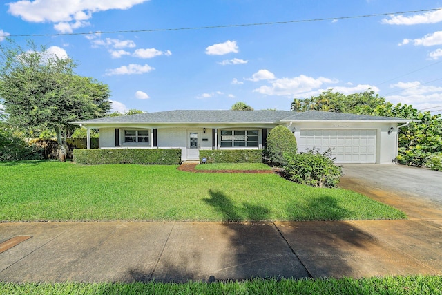 ranch-style house with a front yard and a garage