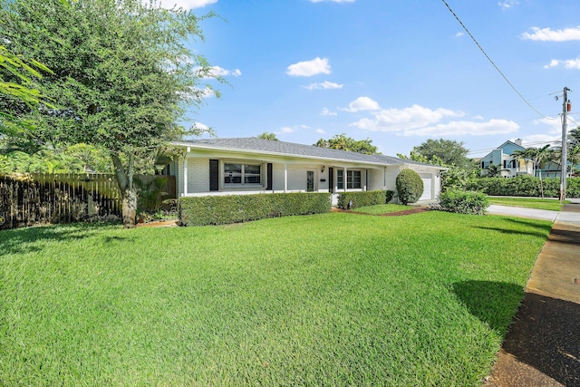 ranch-style house with a front lawn