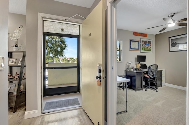 doorway to outside with ceiling fan