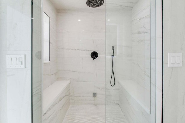 bathroom with tiled shower