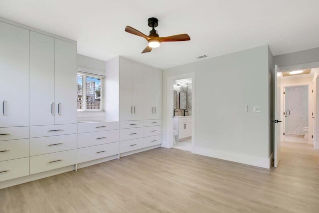 unfurnished bedroom with ceiling fan, connected bathroom, and light hardwood / wood-style floors