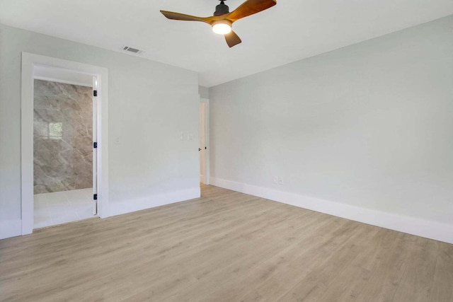 spare room with ceiling fan and light hardwood / wood-style flooring