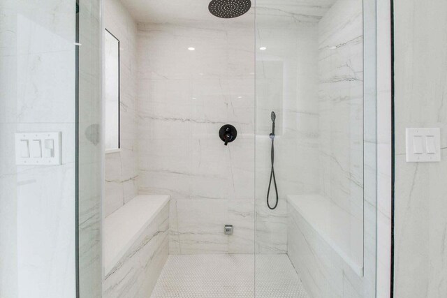 bathroom featuring vanity, a shower with shower door, and toilet