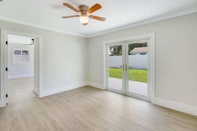 empty room with french doors, light hardwood / wood-style floors, ceiling fan, and ornamental molding