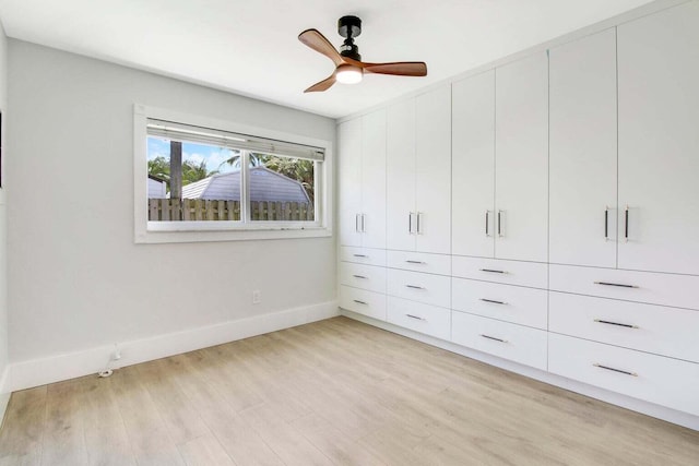 unfurnished bedroom with light hardwood / wood-style flooring and ceiling fan