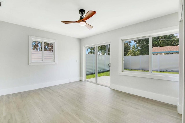 empty room featuring ceiling fan and light hardwood / wood-style floors