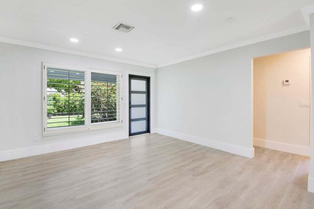 kitchen with white cabinetry, sink, light hardwood / wood-style floors, and appliances with stainless steel finishes