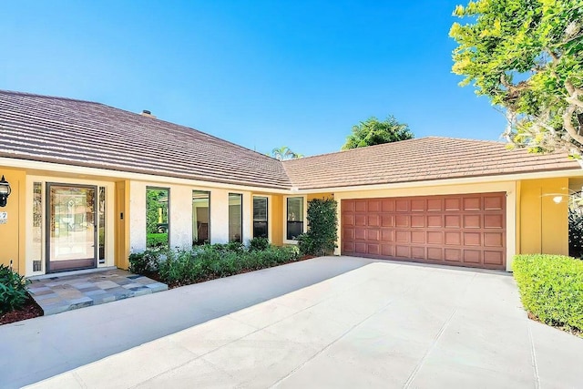 single story home with a garage