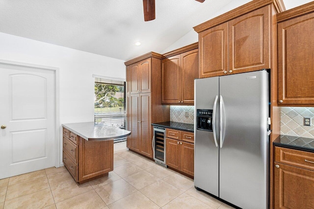 kitchen with stainless steel fridge, light tile patterned floors, tasteful backsplash, and wine cooler