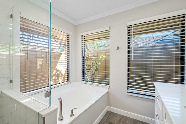 bathroom with vanity, hardwood / wood-style floors, independent shower and bath, and crown molding