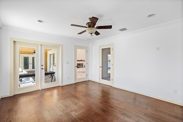 empty room with french doors and ornamental molding