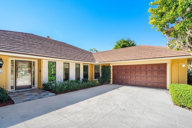 ranch-style house featuring a garage