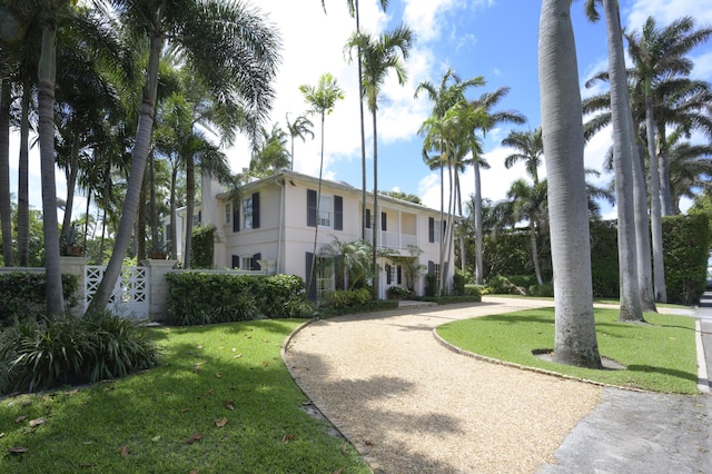 view of home's community with a lawn