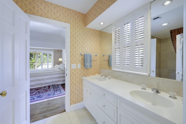 bathroom featuring tile patterned floors and vanity