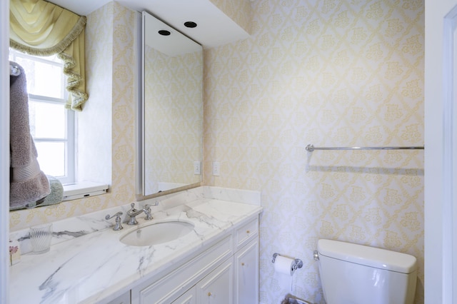 bathroom with vanity and toilet