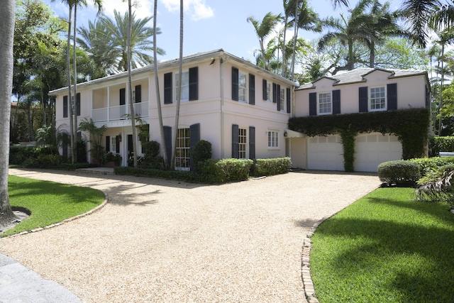 view of front of house with a balcony and a garage