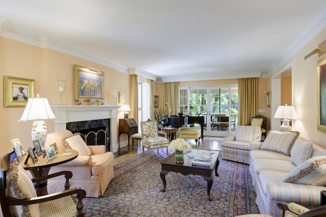 living room featuring crown molding and a premium fireplace