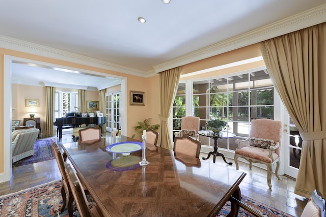 dining room with crown molding and parquet floors