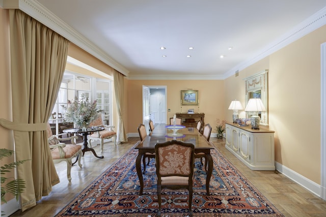 dining room with crown molding and light parquet floors