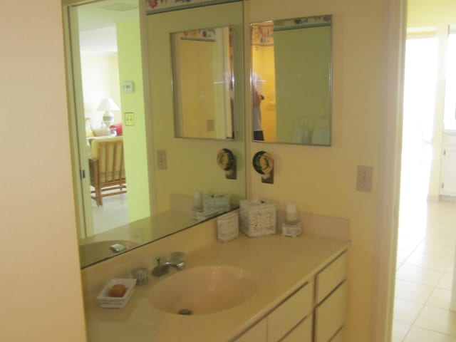 bathroom with tile patterned floors and vanity