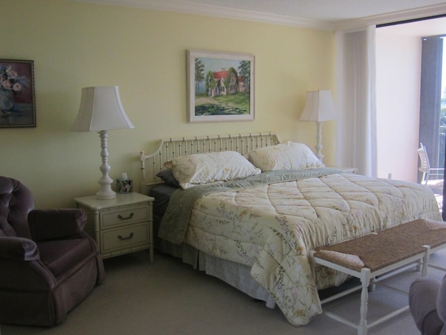 carpeted bedroom with ornamental molding