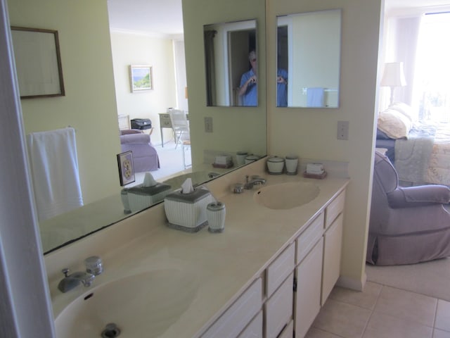 bathroom featuring tile patterned flooring, vanity, and ornamental molding