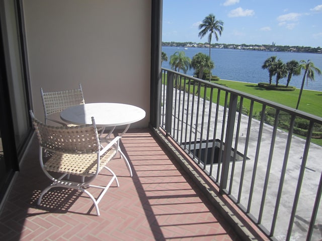 balcony featuring a water view