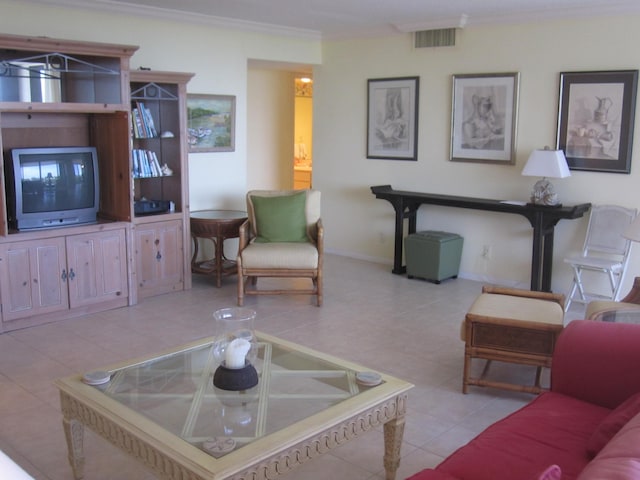 living room featuring light tile patterned flooring and ornamental molding