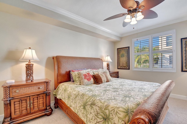 carpeted bedroom featuring ceiling fan and ornamental molding