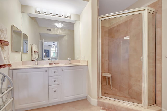 bathroom featuring ceiling fan, tile patterned flooring, vanity, and a shower with door