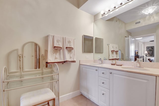 bathroom featuring tile patterned flooring and vanity