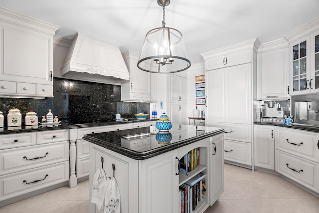 kitchen with premium range hood, backsplash, black cooktop, and white cabinets